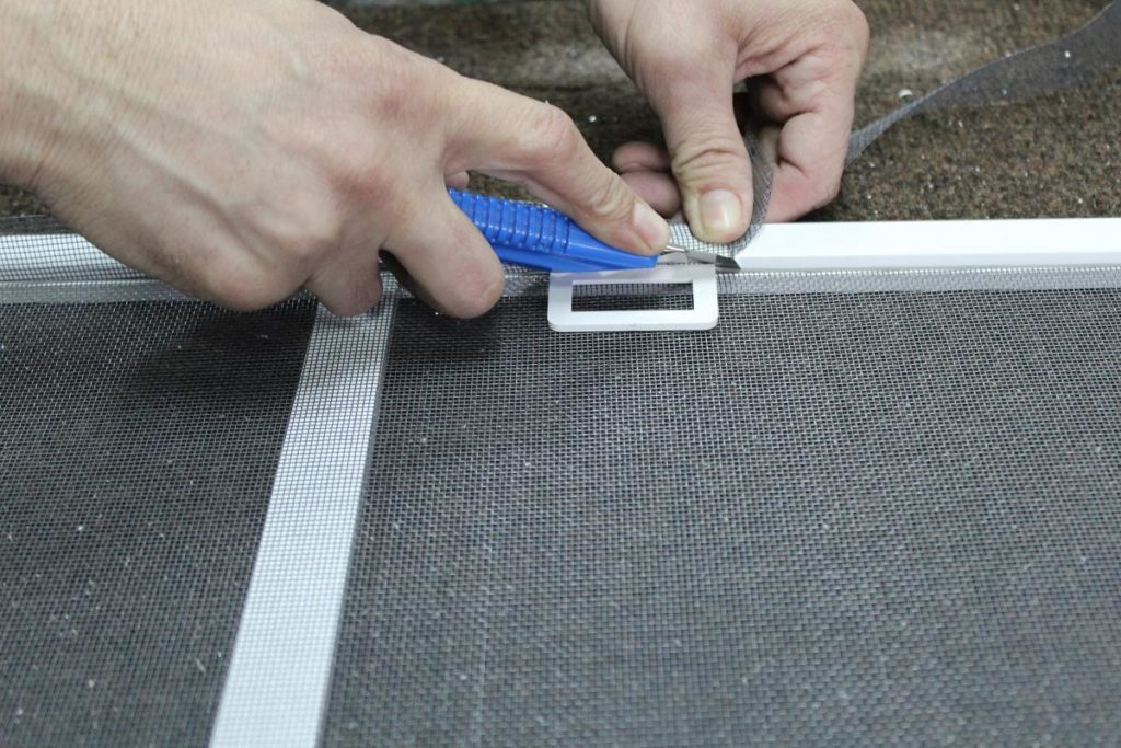 Cutting mosquito net.