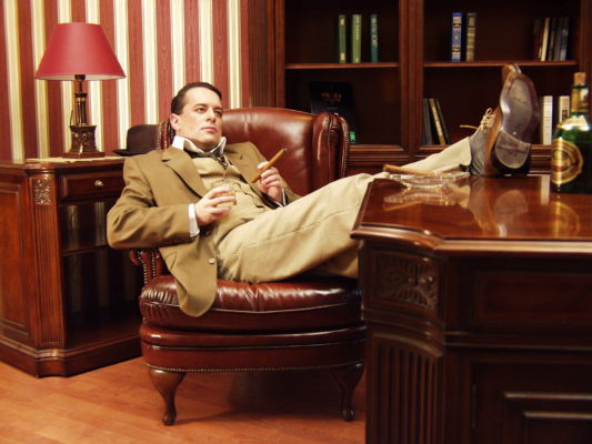 Legs thrown up on the table