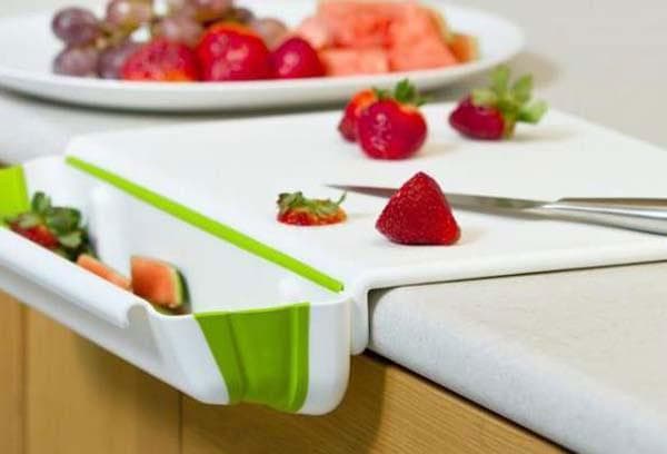 Cutting board with waste container.