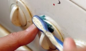 How to clean stove handles from grease without erasing the inscriptions