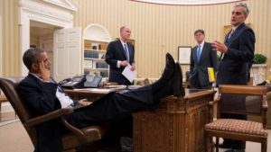 Obama put his feet up on the table