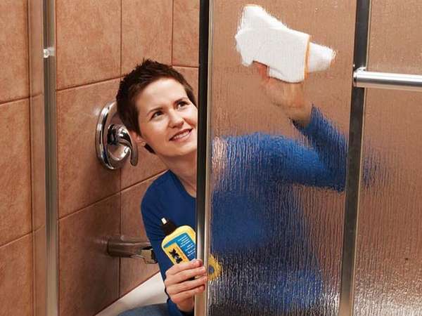 How to clean a shower stall from soap stains and limescale deposits