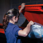 Throwing out garbage.