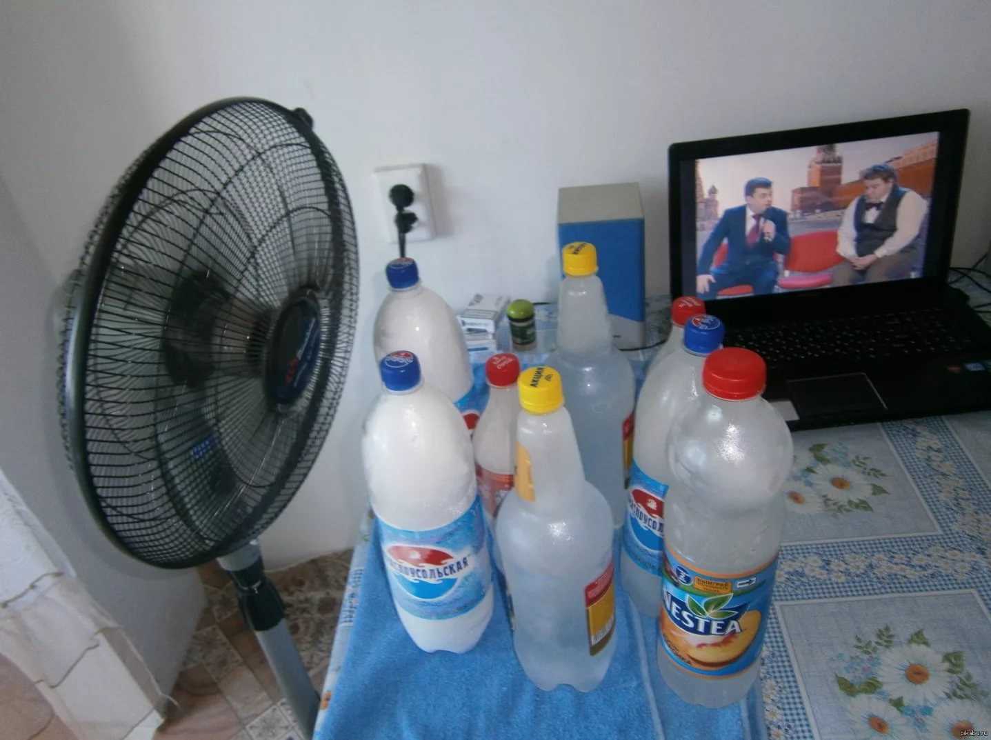 water bottles in front of the fan