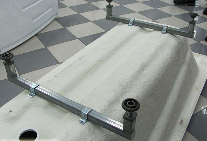 Installing a clawfoot bathtub.