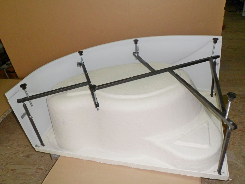 Installing an acrylic bathtub on an existing frame.
