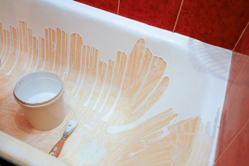 Restoring a bathtub using self-leveling acrylic.