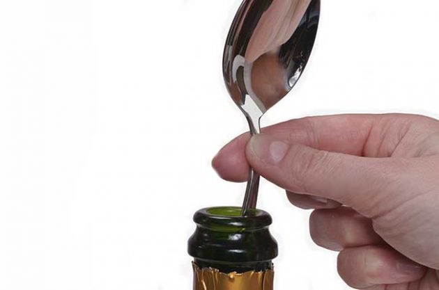 Why put a spoon in open champagne?