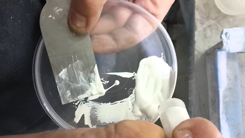 Putty for repairing chips on a ceramic sink.