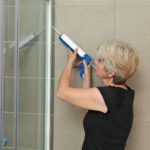 Sealing the shower cabin.