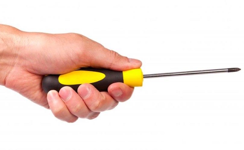 Screwdriver in hand.
