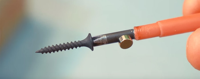 Magnetizing a screwdriver using a magnet.