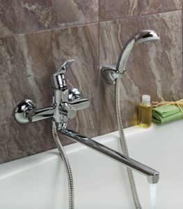 Single lever bath and shower mixer with long spout and shower head.
