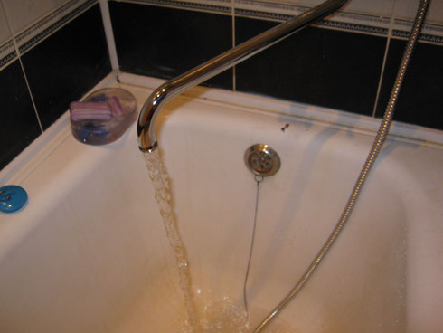 Water flows from the faucet.