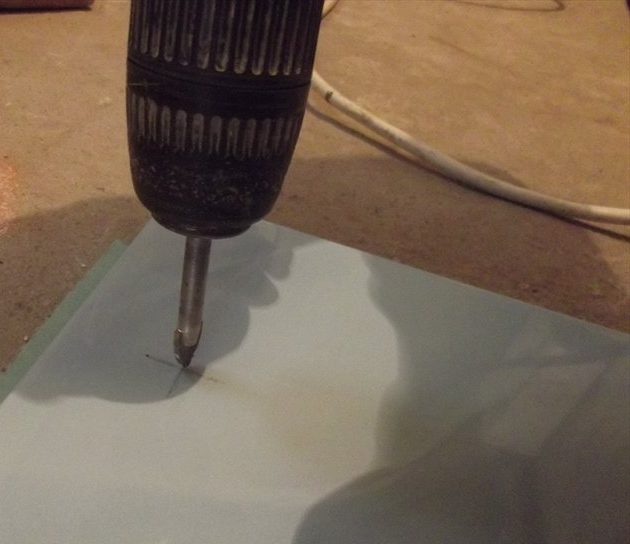 Drilling a ceramic sink.