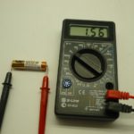 Measuring the voltage in the battery.