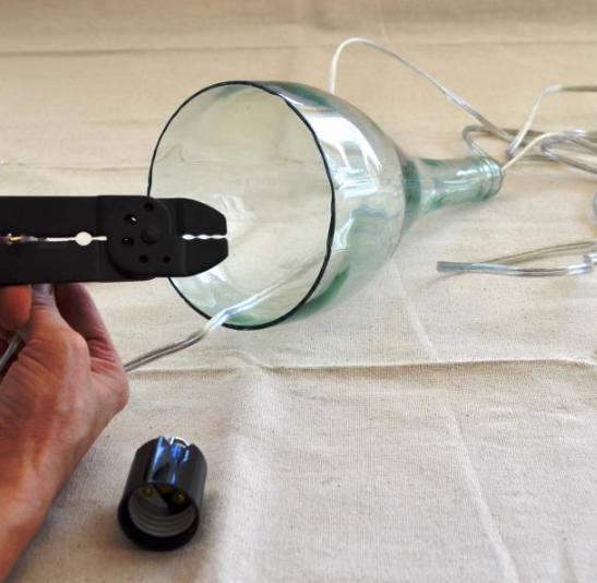 thread the cord into the neck of the bottle