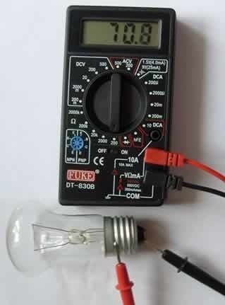 Testing an incandescent lamp.