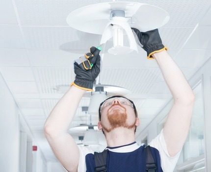 Replacing a light bulb.