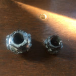 Nut with stripped edges - capital