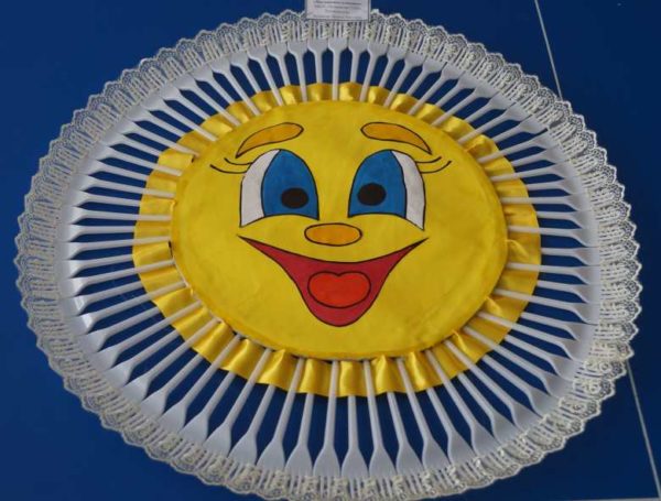 Toy made of plastic forks sun