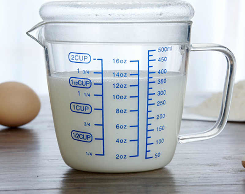 Measuring cup with milk