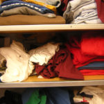 Stack of clothes on shelves