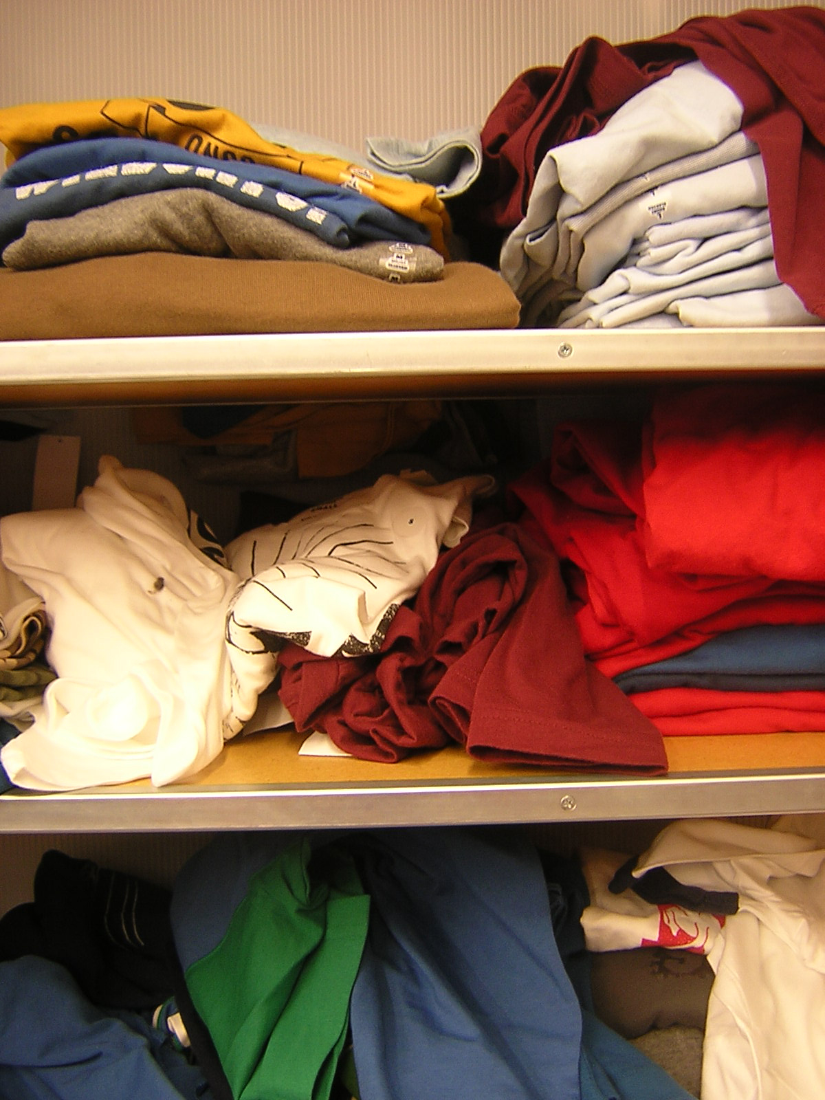 Stack of clothes on shelves