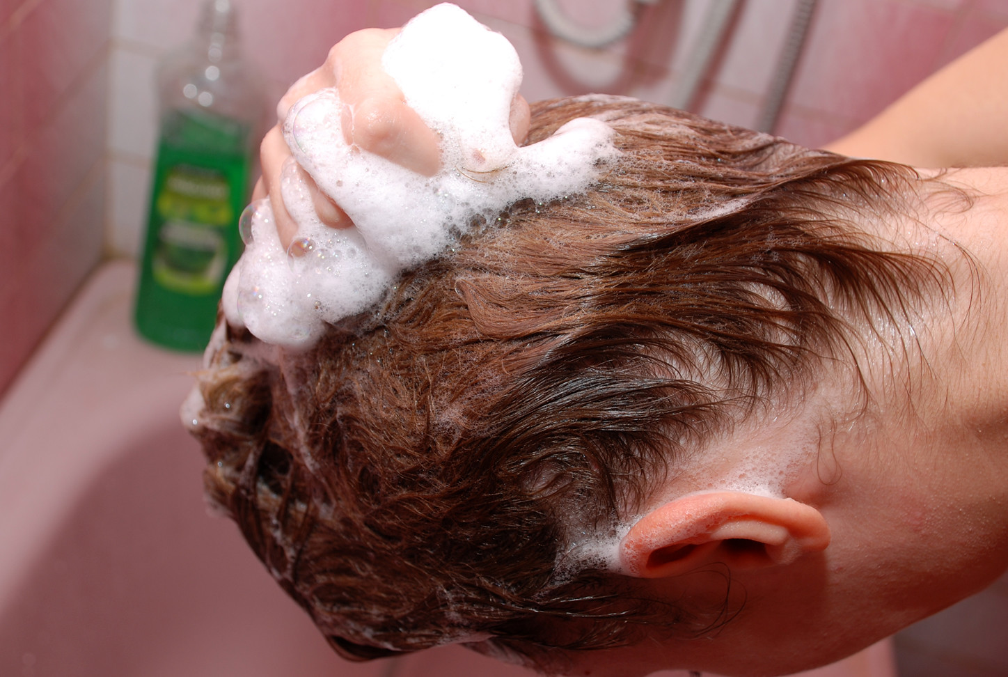 Girl washes her hair