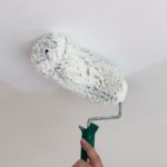 Whitewashing the ceiling in the apartment.