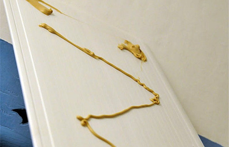 Applying glue to the panel.