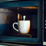 Cup and spoon in the microwave