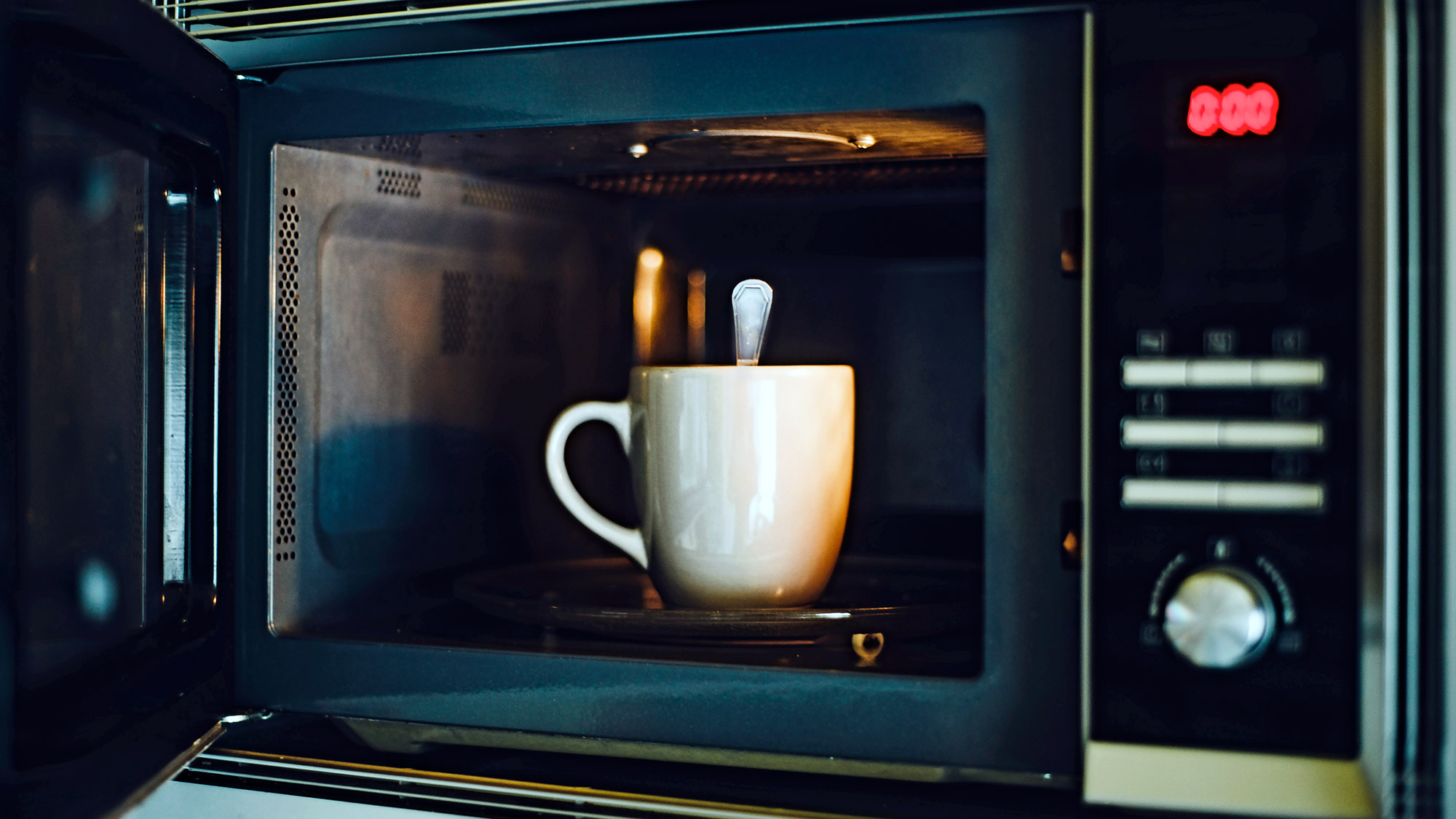 Cup and spoon in the microwave
