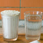 A glass of flour and a glass of water.