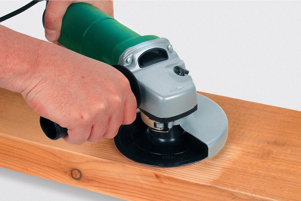 sanding wood with a grinder