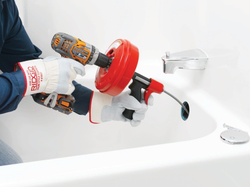 cleaning sewer pipes with a screwdriver