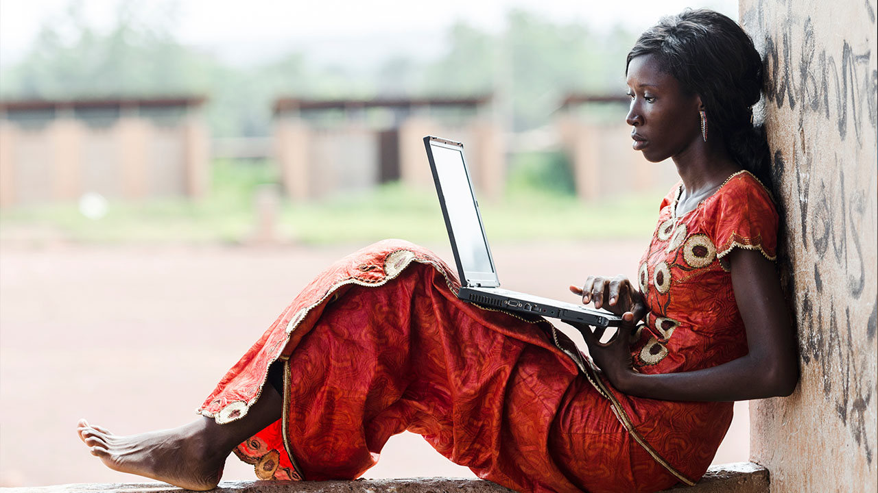 woman with PC in Africa