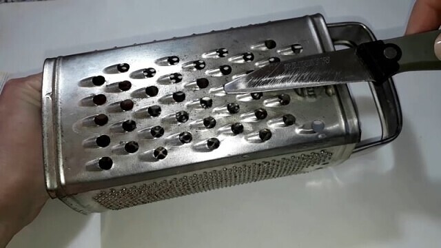 sharpening a grater with a knife