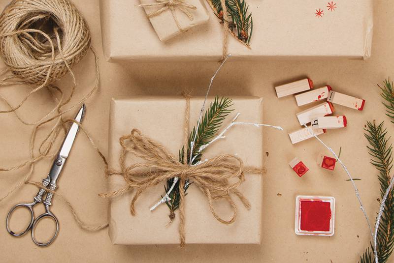 Gift wrapping with plain paper decorated with plants