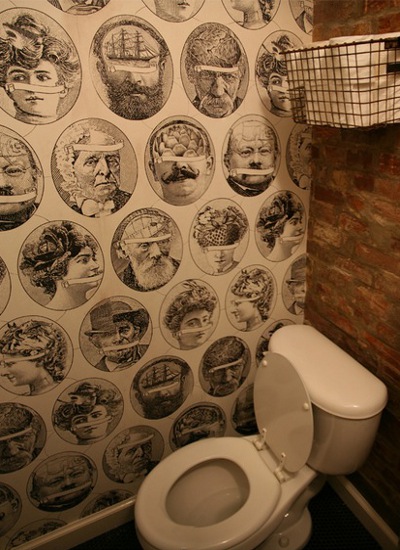 decorating the wall behind the toilet with ironic wallpaper