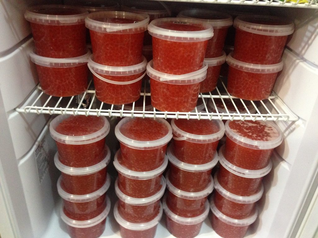 storing red caviar in a plastic jar