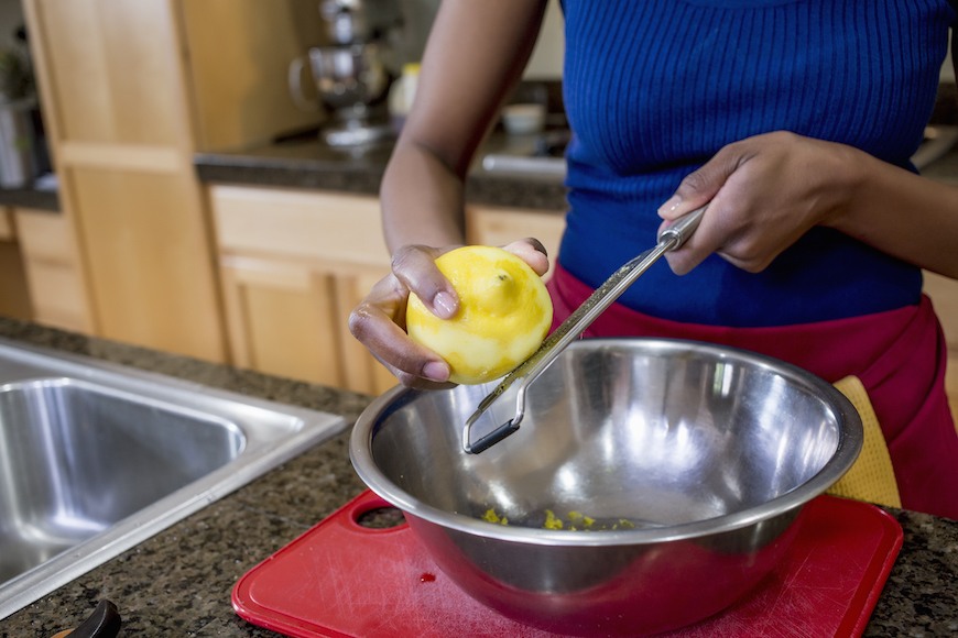 Removing the zest from a lemon