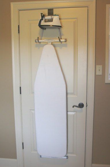 Storing an ironing board on the door