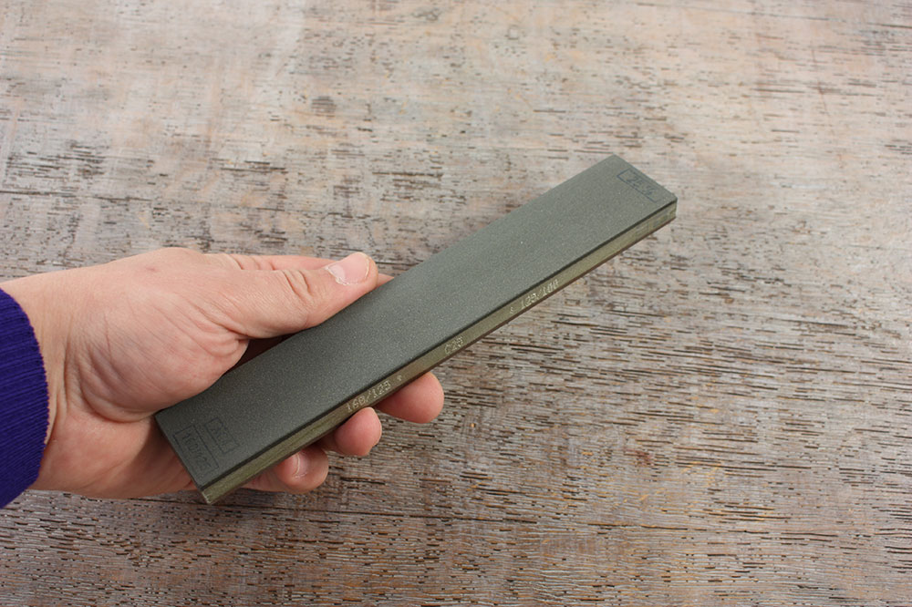 Double-sided sharpening stone.
