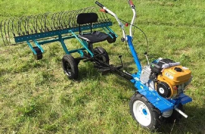 Rake for walk-behind tractor.