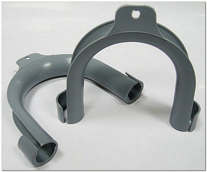 Holder for washing machine hose.