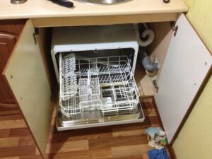 Dishwasher under the sink in a small kitchen
