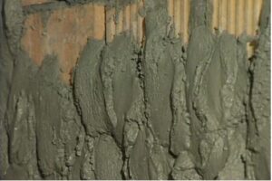 How to properly plaster a brick wall