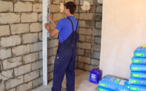 Leveling walls with plaster