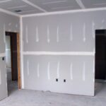 Leveling walls with plasterboard
